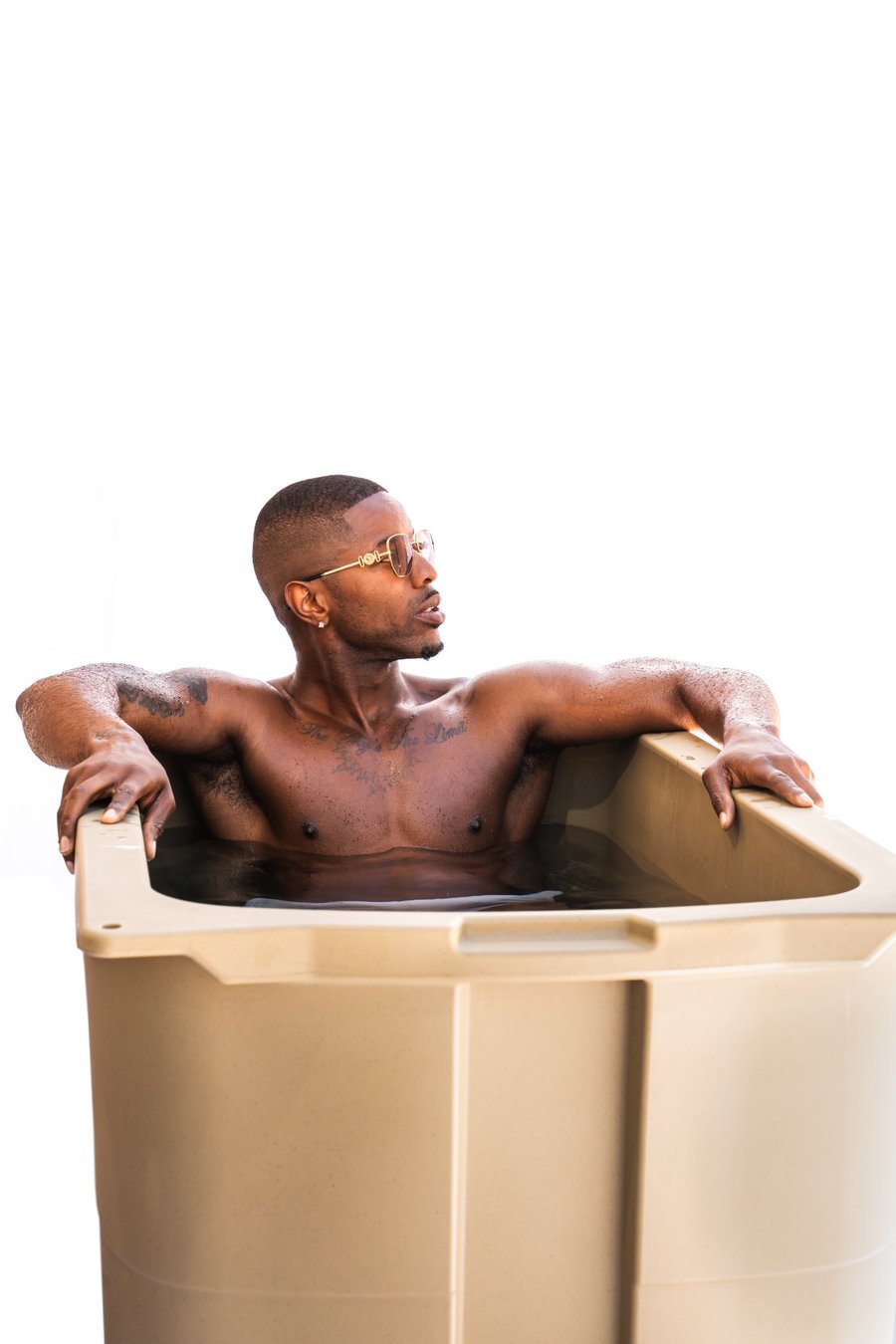 Man using a Frozin 400 cold plunge outdoors